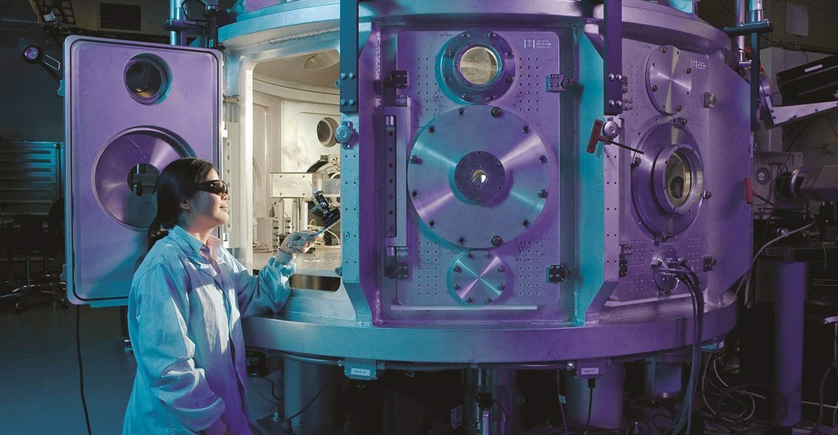 Scientist looking at an advanced machine