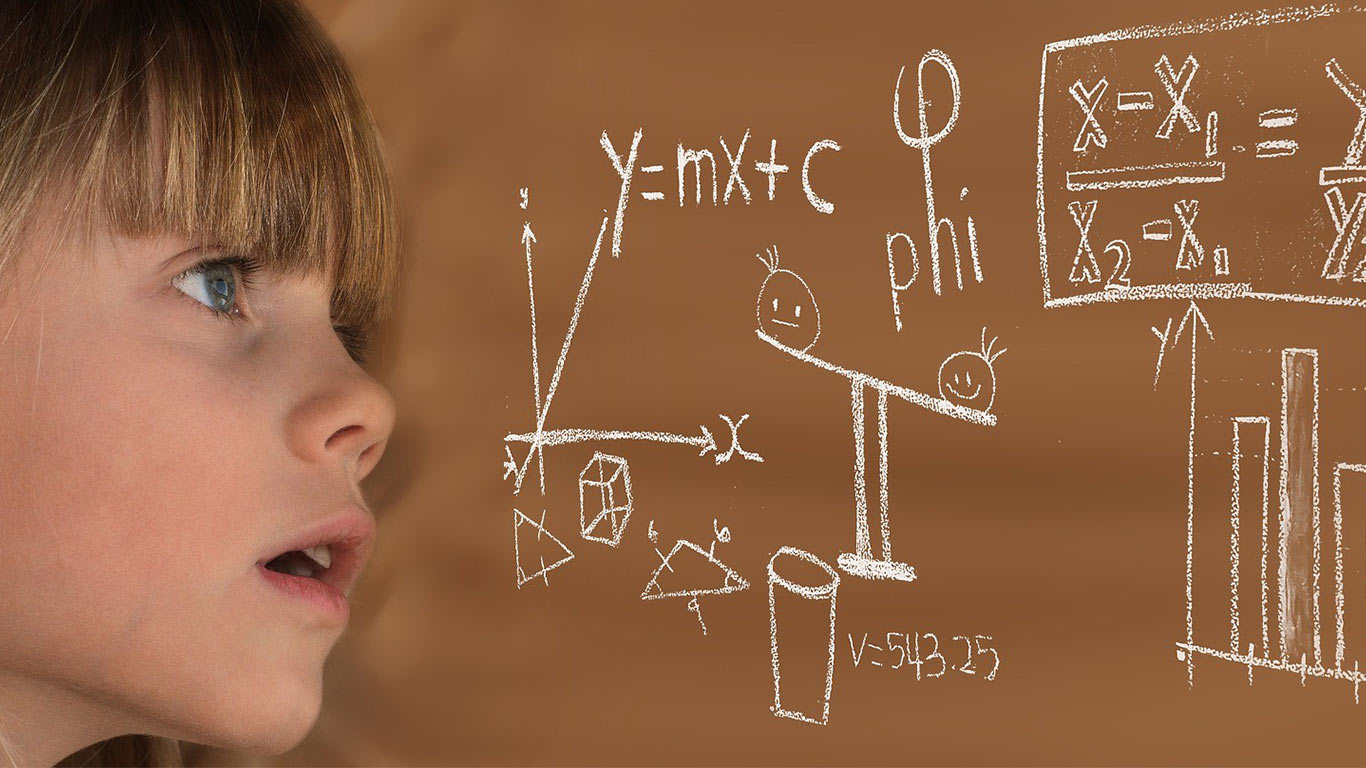 Kid looking at Science Equations